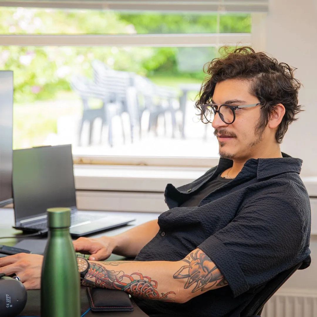 A colleague at his desk
