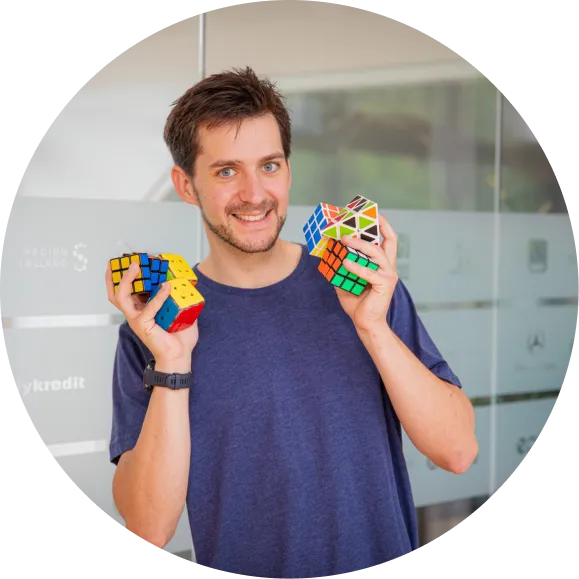 Moritz holding Rubik’s cubes